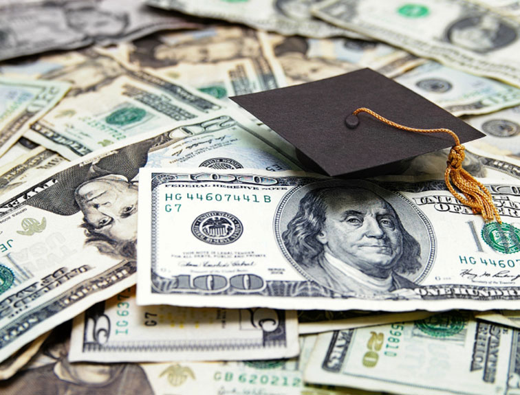 image of cash spread out, a graduation cap on top
