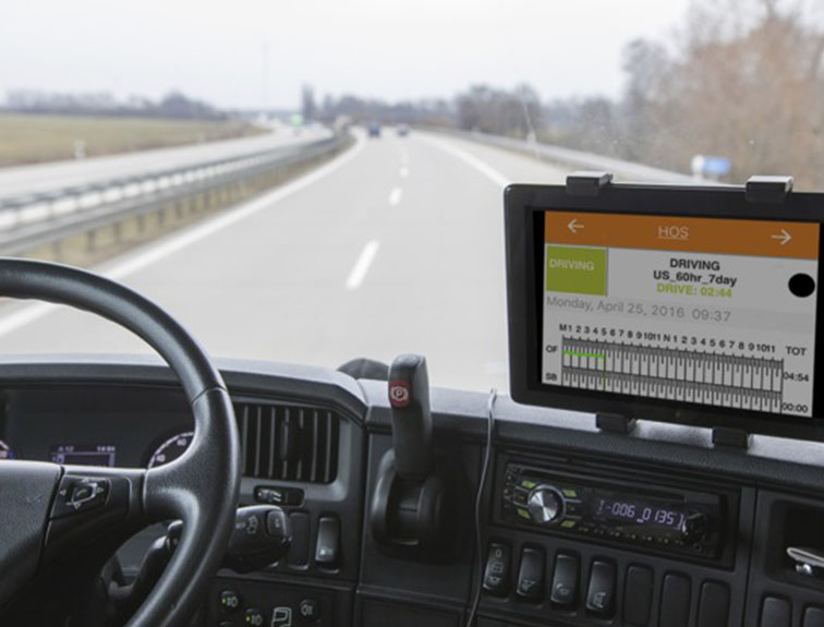 Image of ELD on the dashboard of semi driving on the road