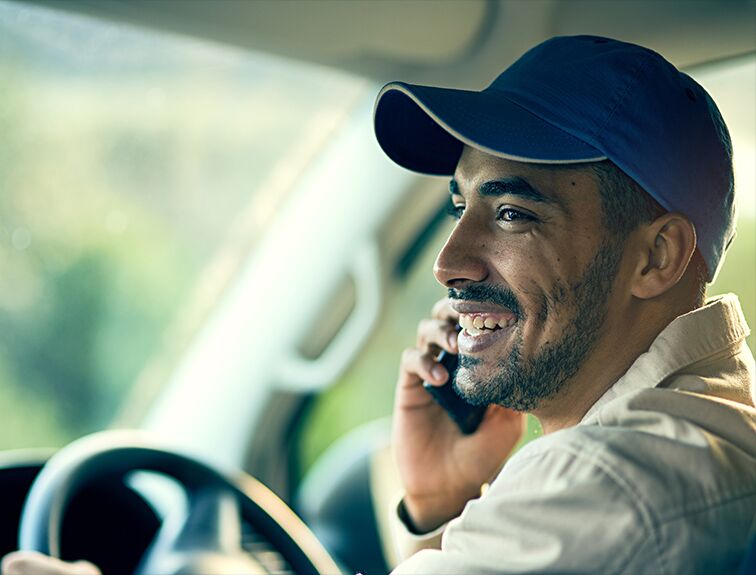 image of truck driver talking on the phone