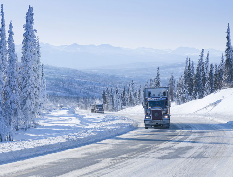 image of Semi driving down road in winter