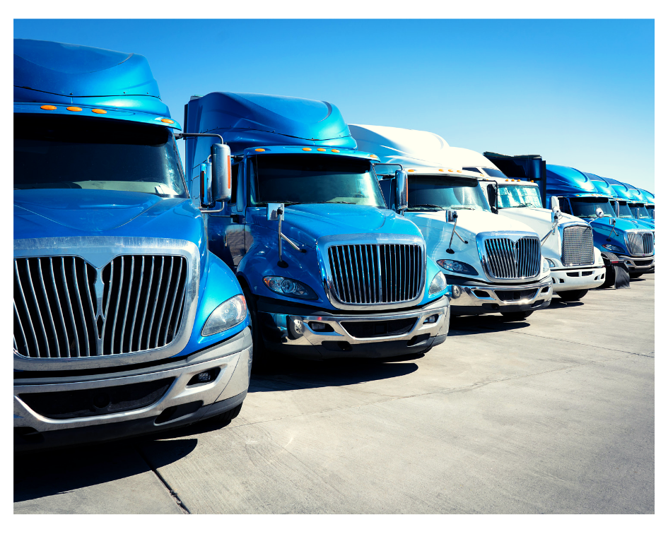 image of row of blue trucks lined up in a parking lot