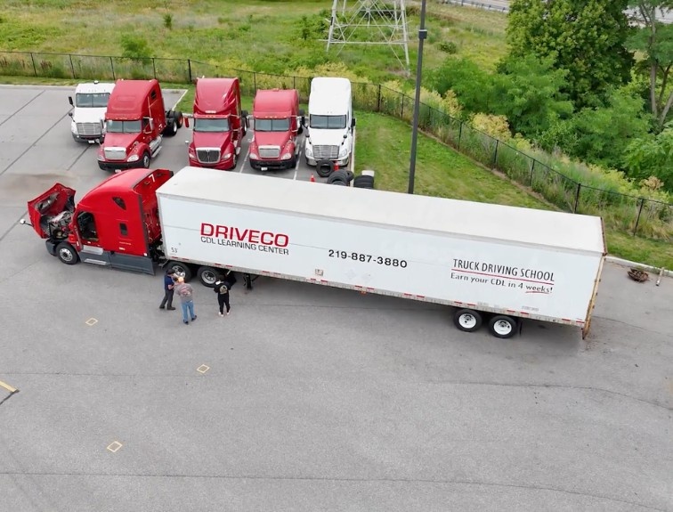 Drone view of DriveCo training yard with 4 semi trucks